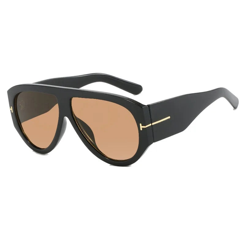 Black sunglasses with gold accents on a white background